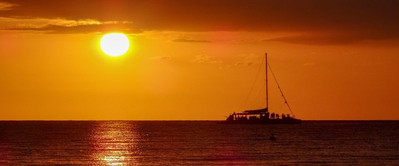 A catamaran at sunset