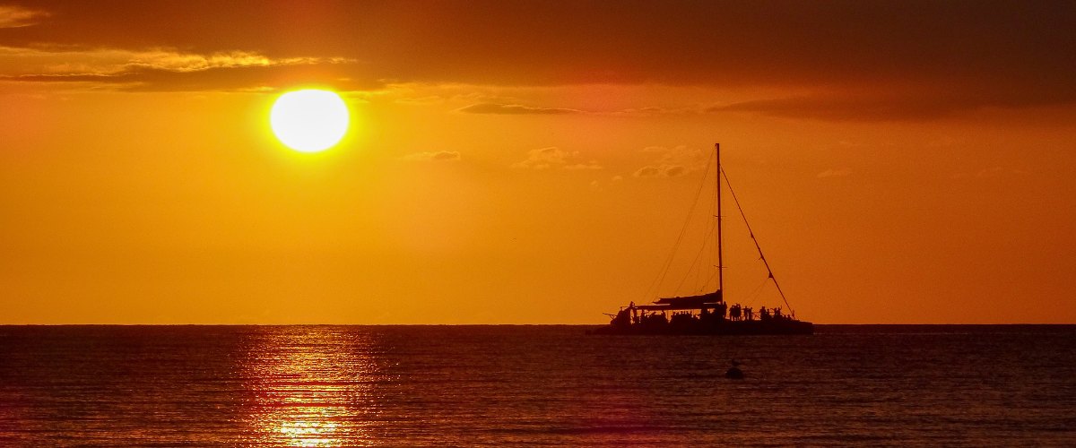 A catamaran at sunset