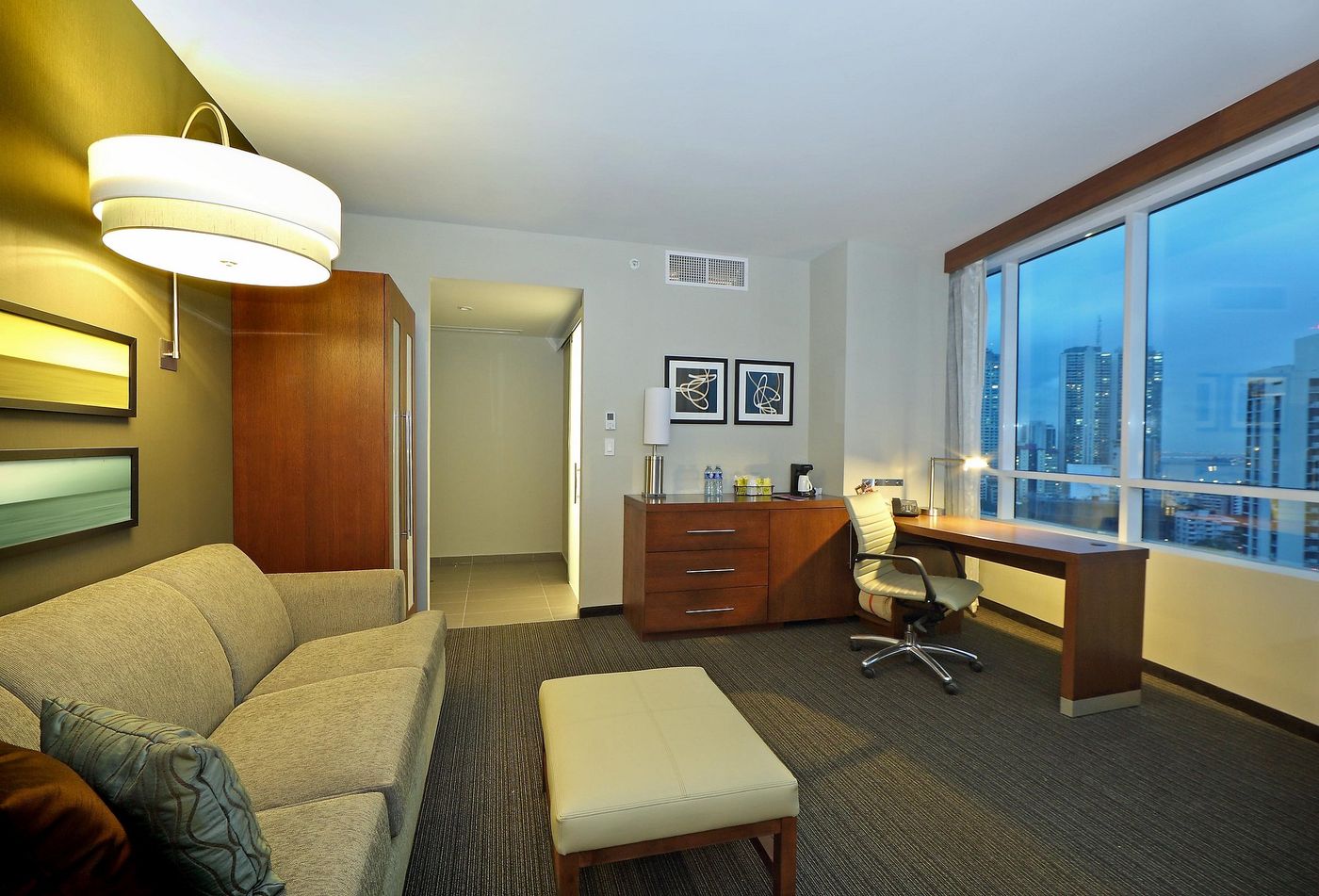 The seating area and desk, with city views